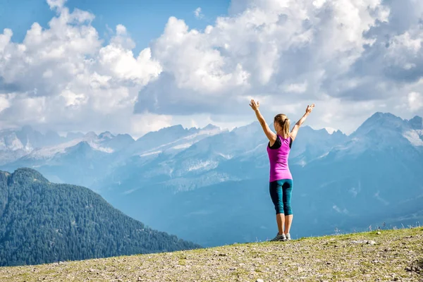 Young woman on top of the mountain Stock Image