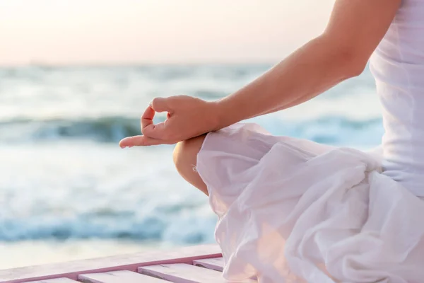 Woman meditating at the sea — Stock Photo, Image