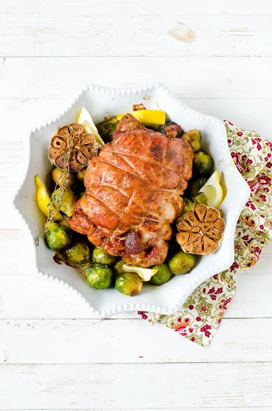 Baked turkey roll with Brussels sprouts, garlic, thyme and lemon — Stock Photo, Image