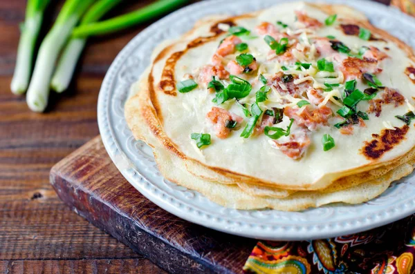 Pancakes with fish, cheese and green onions — Stock Photo, Image