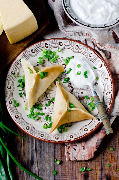 Pancakes stuffed with minced meat and cheese — Stock Photo, Image