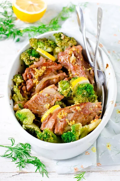 Chicken (turkey) baked with broccoli, lemon and grain mustard — Stock Photo, Image