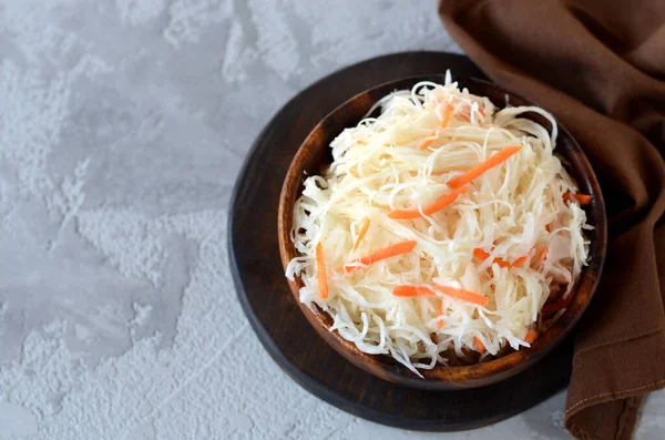 Sauerkraut in a wooden bowl. fermented vegetables