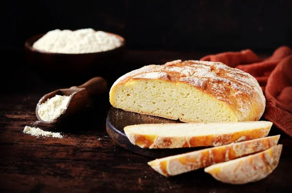 Homemade corn bread on a dark wooden table