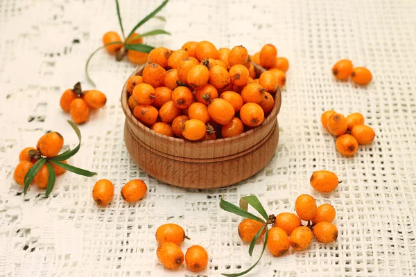 Appetizing sea buckthorn berries in wooden bowl — Stock Photo, Image