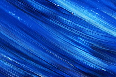 Yaratıcı mavi el boyası arkaplan, duvar kağıdı, doku, fırça darbeleriyle tuval üzerinde akrilik resmin yakın plan parçası.