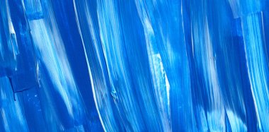 Yaratıcı mavi el boyası arkaplan, duvar kağıdı, doku, fırça darbeleriyle tuval üzerinde akrilik resmin yakın plan parçası.