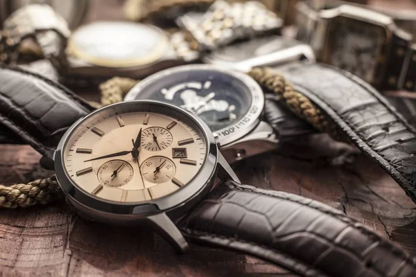 Men watches on wooden table — Stock Photo, Image