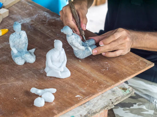 Artist making detail of resin female figure — Stock Photo, Image
