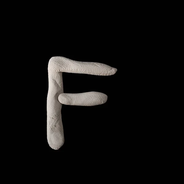 Alphabet F mold by clay on black — Stock Photo, Image