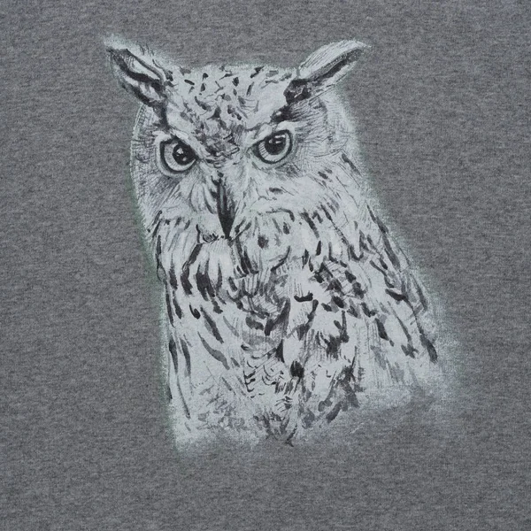 Drawing and painting of Siberian eagle owl on gray fabric