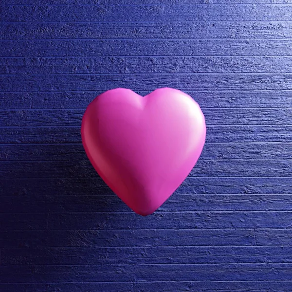 Pink heart shape on blue wooden background. — Stock Photo, Image