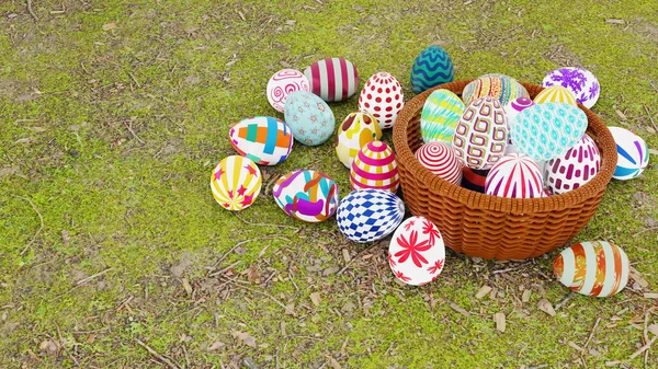 Sada barevných velikonočních vajec umístěte do hnědého proutěného koše na zemi. — Stock fotografie