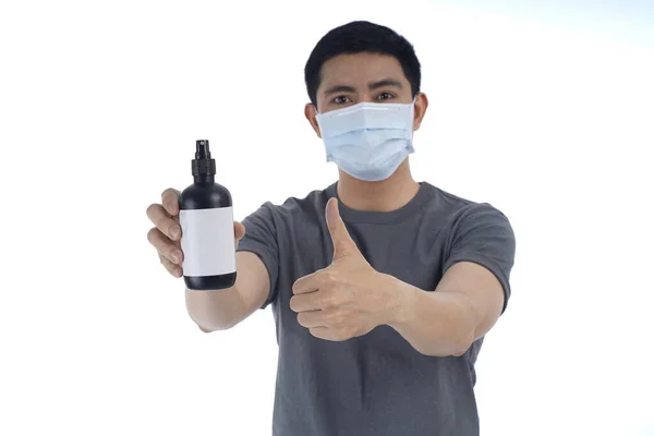 Asian young man in flu mask against with a corona virus pandemic, or prevent flu disease or cold during winter