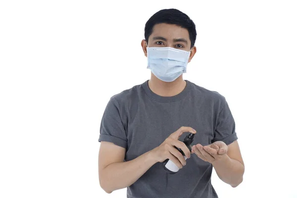 Asian young man in flu mask against with a corona virus pandemic, or prevent flu disease or cold during winter