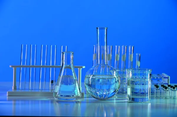 Laboratory Glassware on Reflective Table — Stock Photo, Image