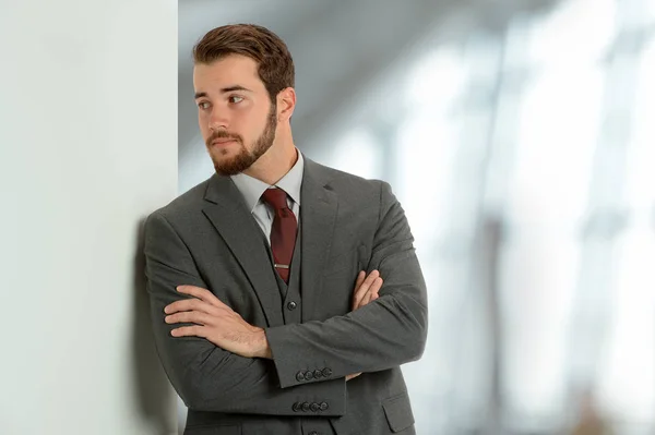 Young Businessman Leaning on Wall — Stock Photo, Image