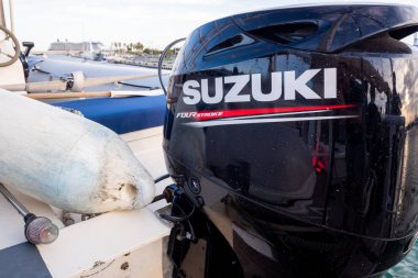 Valencia, Spain - November 2, 2019: Outboard motor of the Suzuki clipart