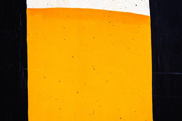 Υφή φόντο ενός τοίχου βαμμένο με μαύρο, πορτοκαλί και whi — Φωτογραφία Αρχείου