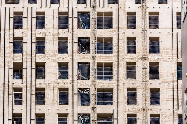 Dettaglio di un edificio in costruzione con muri in cemento . — Foto Stock