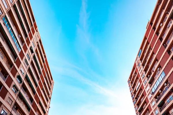 High housing building with blue sky in the background and copy s