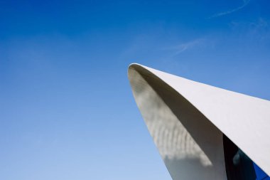 Modernist rounded architecture of white cement and blue sky in V