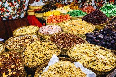 Delicious candied fruits and nuts for sale at a street market.