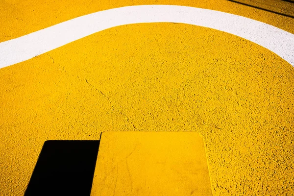 Düz sarı şekilli bir zeminin soyut arkaplanı — Stok fotoğraf