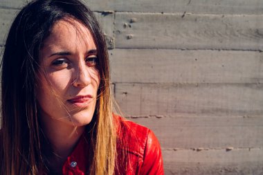 Young woman looking at camera with provocative and sexy face.
