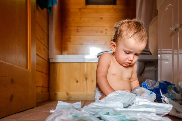 Busy baby making a mess is a daily scene at home. — Stock Photo, Image