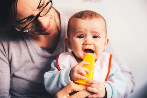 Baby smiling and drooling when trying for the first time an ice — Stock Photo, Image