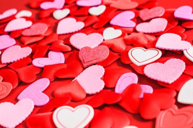 A red background with hearts and space for love text.