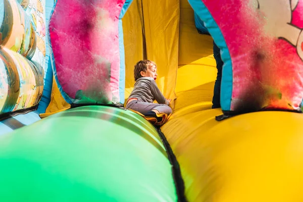 Child Sliding Colorful Inflatable Bounce Castle Having Great Time — Stock Photo, Image