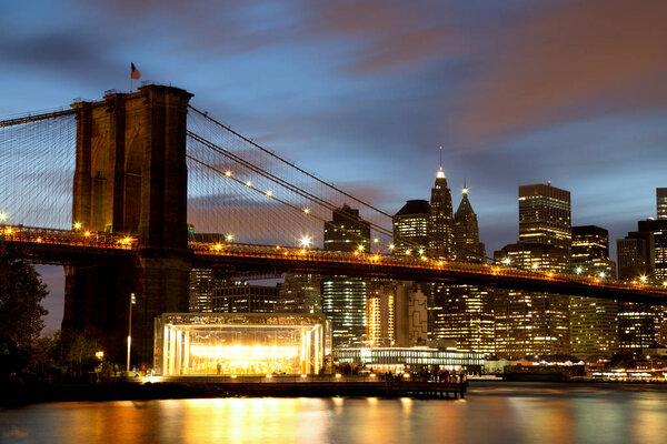 New York City Manhattan Downtown with Brooklyn Bridge at dusk