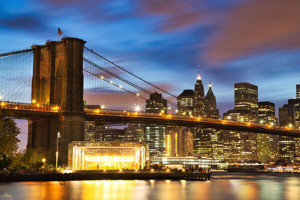 New York City Manhattan Downtown with Brooklyn Bridge at Dusk, USA