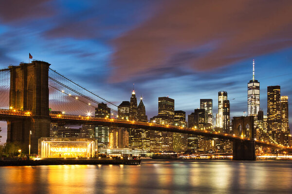 New York City Manhattan Downtown with Brooklyn Bridge at Dusk, USA