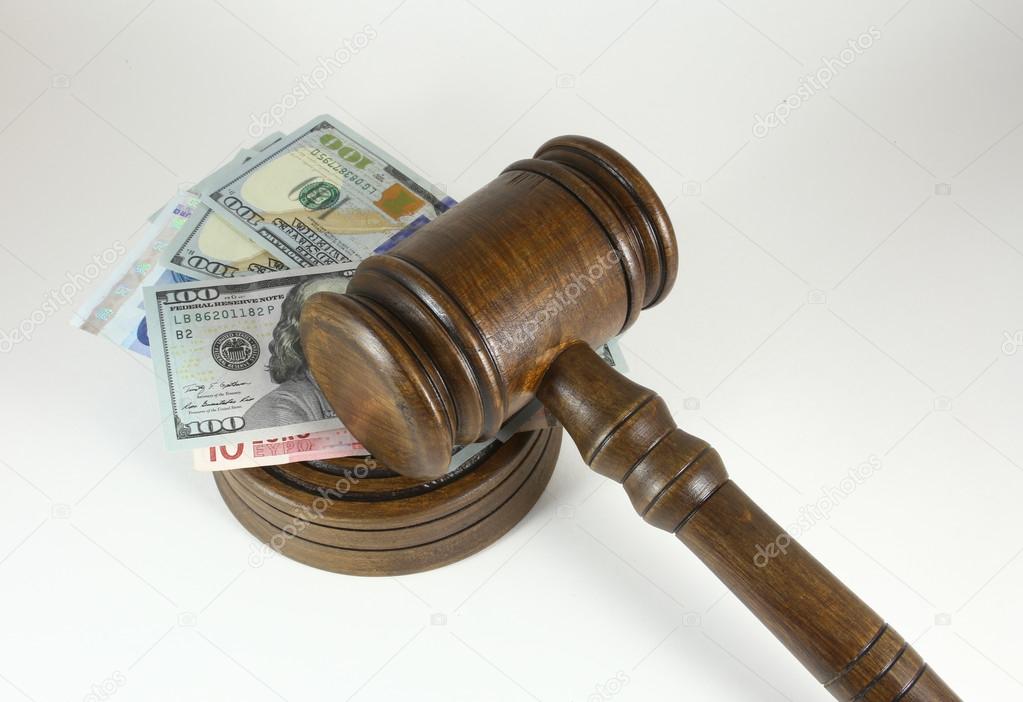 Auction Or Trial Concept With Auctioneers  Judges Gavel And Scattered Money Heap On Wooden Table, Close Up,