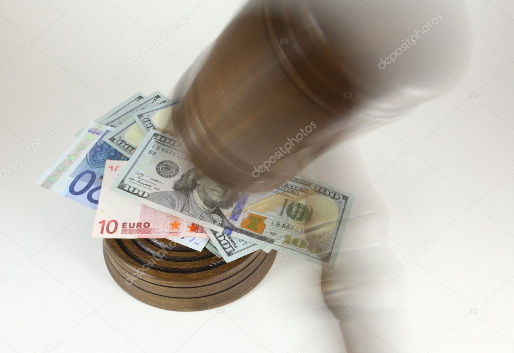 Auction Or Trial Concept With Auctioneers Judges Gavel And Scattered Money Heap On Wooden Table, Close Up,