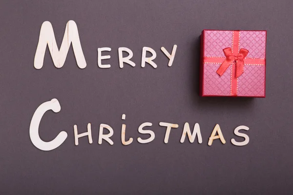 शुभेच्छा ख्रिसमस. ग्रीटिंग कार्ड आणि गिफ्ट बॉक्स. एक्समास पार्श्वभूमी . — स्टॉक फोटो, इमेज