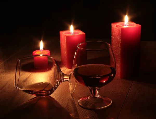 Christmas composition photo cognac glass and candle on black background — Stock Photo, Image