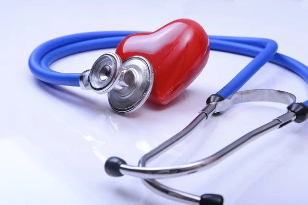 Red heart and a stethoscope on white background — Stock Photo, Image