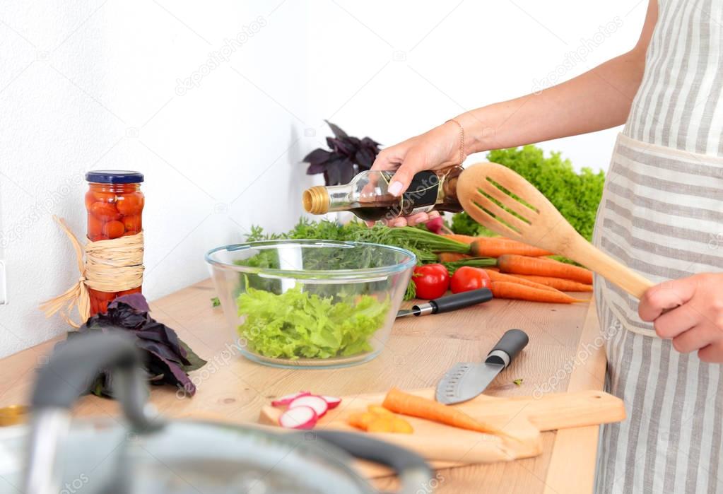Fresh vegetables on the cutting board are falling in the pot, concept of cooking