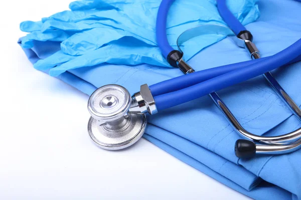 Medizinisches Stethoskop, Handschuhe, rx Rezept auf blauer Arztuniform Nahaufnahme. Fachgeschäft für medizinische Instrumente und Instrumente, Konzept zur Blutdruckmessung — Stockfoto