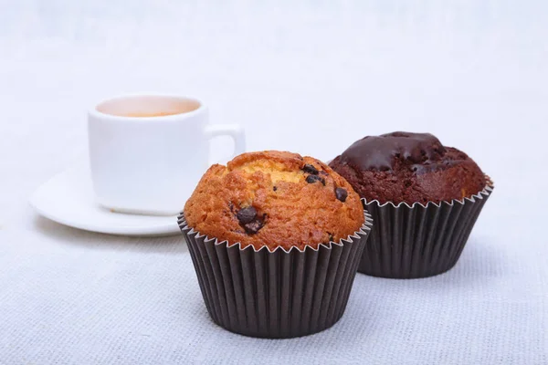 Fresh homemade muffin, cake and white cup of Cappuccino on white background. — Stock Photo, Image