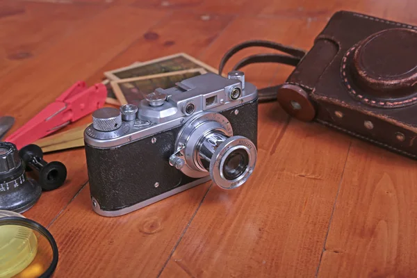 Vintage old film photo-camera in leather case — Stock Photo, Image