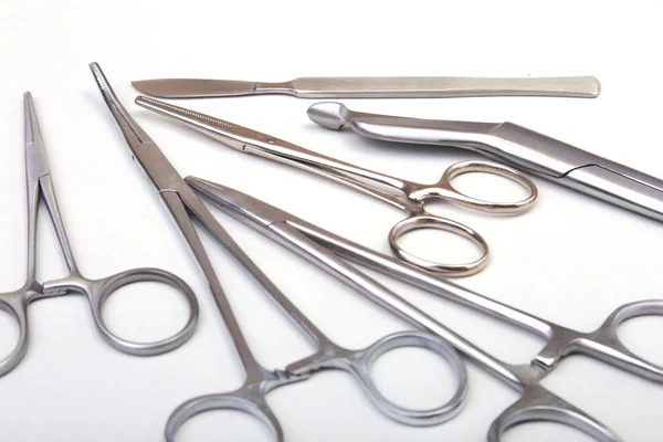 Close Up Surgical instruments and tools on white background. Selective focus. — Stock Photo, Image