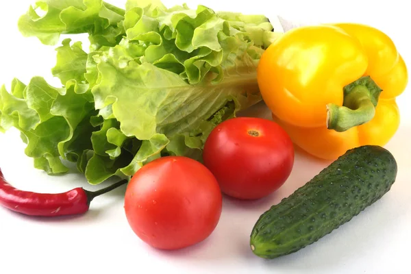 Assorted vegetables, fresh bell pepper, tomato, chilli pepper, cucumber and lettuce isolated on white background. Selective focus. — Stock Photo, Image