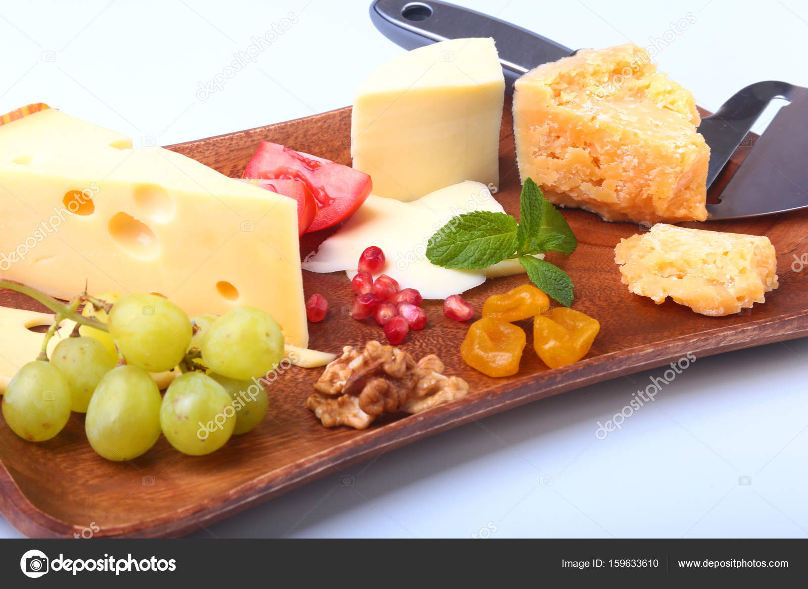 Assortment Of Cheese With Fruits Gs Nuts And Knife On A Assortment Of Cheese With Fruits Gs Nuts And Knife On A Wooden Serving Tray Photo By Vicby