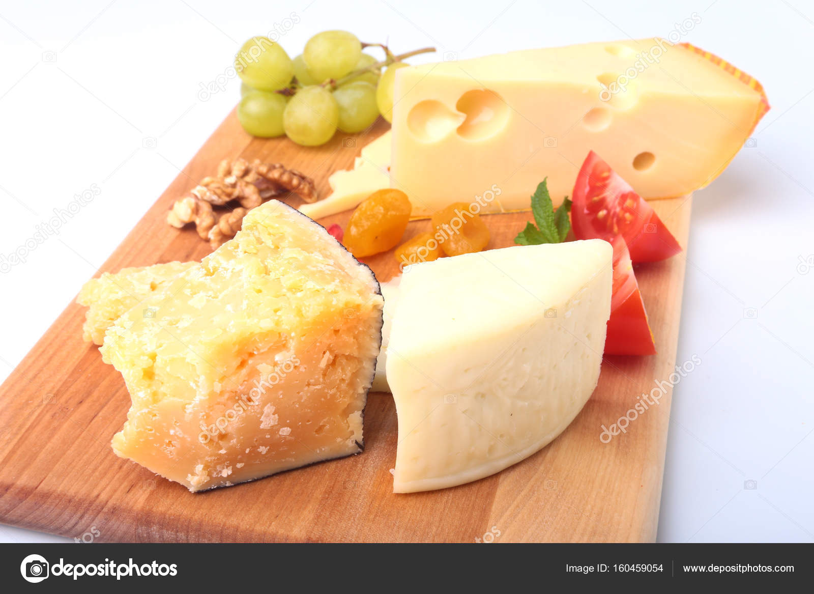 Assortment Of Cheese With Fruits Gs Nuts And Knife On A Assortment Of Cheese With Fruits Gs Nuts And Knife On A Wooden Serving Tray Photo By Vicby