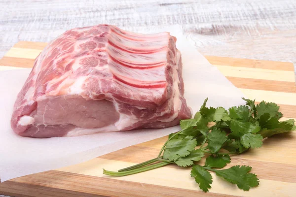 Raw pork chops, spices and basil on cutting board. Ready for cooking. — Stock Photo, Image